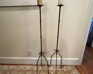 R260 - $175. 19th Century Iron Floor Candlestick holders. Measures 15" wide x 55" tall. 