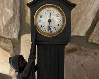 P62 - $125. 1930s Novelty Clock - Dutch Girl holding Umbrella next to a Grandfather Clock. Clock Face reads Made in France and Clock Case is also stamped Made in France. Measures 5" wide x 13" tall. Currently not running. 
