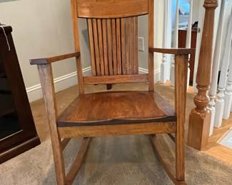 R105 - $60. Wooden Rocking Chair. Very deep seat. Measures 26" wide x 24" deep x 33" tall. Floor to Seat is 14". 