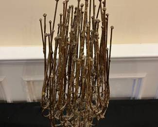 P63 - $75. Brutallist Sculpture. Unsigned. Measures 9" at the widest point x 24" tall. 