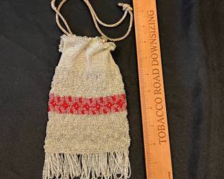 R143 - $35. Antique Microbeaded Purse. Fine Crochet frame with clear beads attached. Has lost a few strands of beads along the bottom with age. 