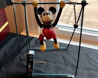 R176 - $75. Vintage Wind Up Mickey Celluloid Trapeze. Moves freely but the wind up function needs a little assistance to move. 