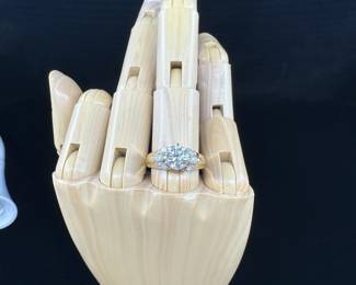 A1 - $1500. Ladies Diamond Engagement Ring. Size 6/6.5. 14KT "AB" stamped inside. 1 large center Diamond with Round Cut and 6 Marquise Cut surrounding Diamonds. (Retail was 7k)