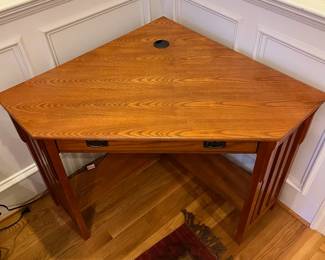 R137 - $75. Mission Style Corner Desk (2012). Has keyboard slide out. Comes out from each corner 34". Corner to corner is 48" x 30.25" tall. 