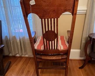 R134 - $50. Single Chair Solid Wood. Antique or very vintage. The chair was once caned and later a solid piece was placed on the top. Measures 22" wide x 17.25" x 42.5" tall. 