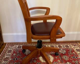 R151 - $50. Swivel, Rolling Office Chair with leather seat. Measures 25.25" wide x 25" deep x adjust from 32.5 - 36" tall. 
