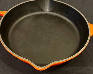 R242 - $45. Le Creuset 10.25" Skillet "Flame" Color. 