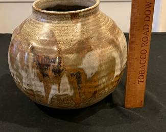 P67 - $20. Pottery Vase signed "Davis". Measures 9" wide x 8" tall. 