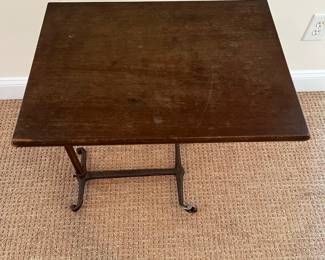 P77 - $125. Antique Hospital Bed Table - Adjustable Height Side Table. Industrial Style with metal frame and wooden top. Measures 24" x 18" x 26.5" tall adjusts up to 32" tall. Wooden top shows some surface wear - base is in excellent condition. (Identical table online has a J. R. Baker & Sons sticker - ours does not but I'm confident that is the maker)