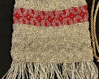 R143 - $35. Antique Microbeaded Purse. Fine Crochet frame with clear beads attached. Has lost a few strands of beads along the bottom with age. 