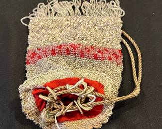R143 - $35. Antique Microbeaded Purse. Fine Crochet frame with clear beads attached. Has lost a few strands of beads along the bottom with age. 