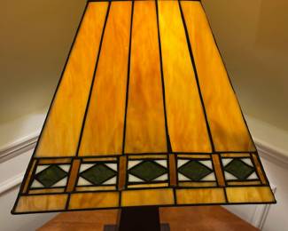 P73 - $40. Tiffany Style Table Lamp. Shade is in great condition but top that clips onto lamp harp needs adjusted. Measures 25" tall. 