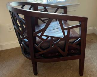 P100 - $150. Crate & Barrel Ankara Chair. Leather cushion & Caning are in ver good condition! One back leg has scrape marks (you don't see if they're in the corner!) Measures 29.5" wide x 27" deep x 30" tall. Floor to seat is 17". 