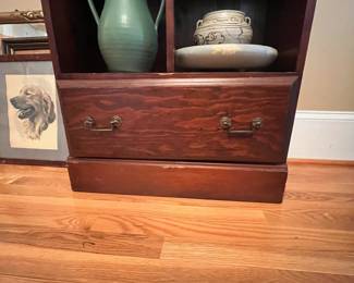 P18 - $125. 1 of 3 available. Wooden Bookcase / Display Cabinet. Single Drawer at the bottom. Measures 24.5" wide x 11" deep x 82.5" tall. Shelves are not adjustable. 