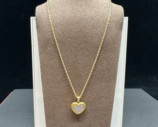 A2 - $400. 14kt gold necklace 16" twisting chain. Charm is 18kt with diamonds. 