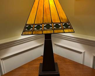 P73 - $40. Tiffany Style Table Lamp. Shade is in great condition but top that clips onto lamp harp needs adjusted. Measures 25" tall. 
