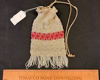 R143 - $35. Antique Microbeaded Purse. Fine Crochet frame with clear beads attached. Has lost a few strands of beads along the bottom with age. 