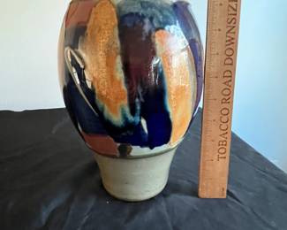 P95 - $15. Signed Pottery Vase. Measures 7" at the widest point x 10" tall. 