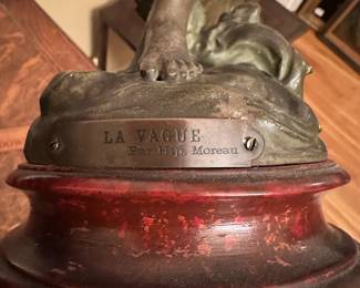 P64 - $125. Antique La Vague Par Moreau Lady Statue with Wooden Base painted with marbled look. Plaque on the bottom reads - "La Vague Par Hip. Moreau". Measures 20" tall. (I believe it is Spelter with bronze paint)