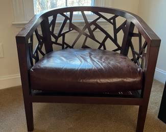 P100 - $150. Crate & Barrel Ankara Chair. Leather cushion & Caning are in ver good condition! One back leg has scrape marks (you don't see if they're in the corner!) Measures 29.5" wide x 27" deep x 30" tall. Floor to seat is 17". 