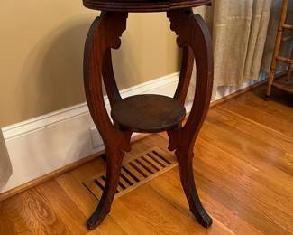 P17 - $35. Carved Oak Plant Stand / Fern Stand. Measures 12.5" x 25" tall. Top has water damage and some bending. Will still work great as a plant stand!