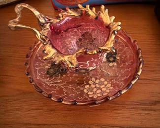 Antique cranberry glass cup and saucer with gold trim $60.00