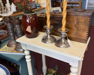 silver candlesticks, white wood table