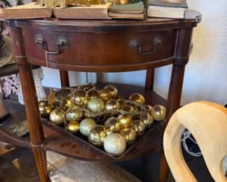 solid wood side table, brass bells, pears, gold ornaments