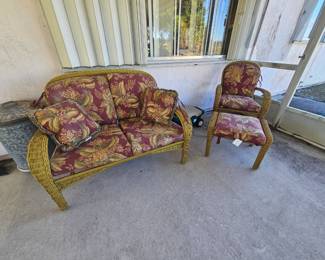 Two piece plus ottoman set plastic Rattan over aluminum frames with cushions and throw pillows $125 firm