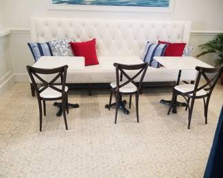 Tufted banquette - white - two available. Marble top square tables with wrought iron bases - 7 available. Bistro chairs - 9 available 