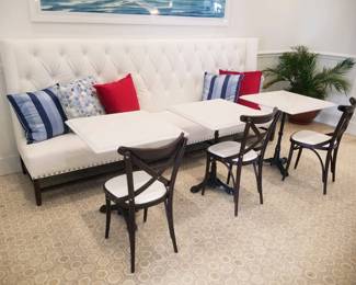 Tufted banquette - white - two available. Marble top square tables with wrought iron bases - 7 available. Bistro chairs - 9 available 