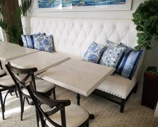 Tufted banquette - white - two available. Marble top square tables with wrought iron bases - 7 available 