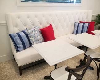 Tufted banquette - white - two available. Marble top square tables with wrought iron bases - 7 available. Bistro chairs - 9 available 