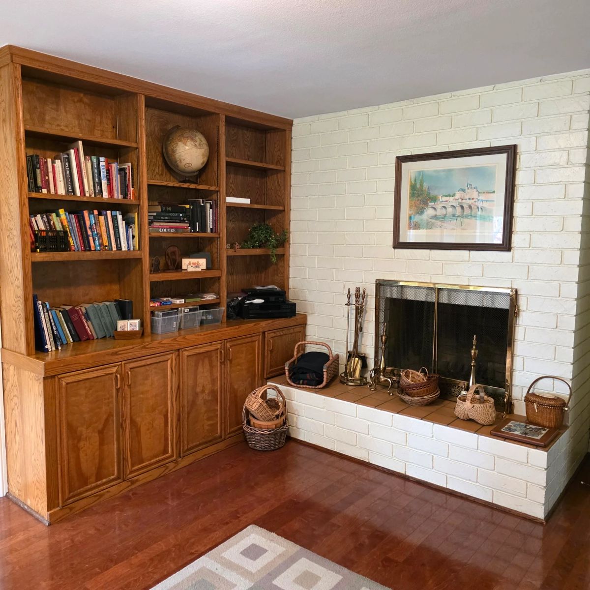 Books, vintage books, Sony 5-disc CD changer, Sony DVD player, DirecTV receiver, baskets