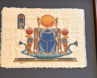 Scarab and other traditional Egyptian symbols on Papyrus