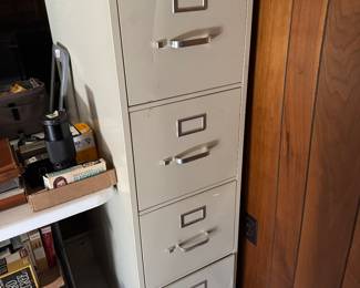 We have two tan and two black four drawer filing cabinets for sale