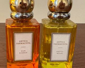 Partial Lot: 2 Antica Farmacista Fragrance Bottles Sun Kissed & Happy Hour

This partial lot includes 2 Antica Farmacista fragrance bottles: 'Sun Kissed' and 'Happy Hour.' Both glass bottles feature visually vibrant orange and yellow liquids respectively, each with a distinctive chrome spherical cap.