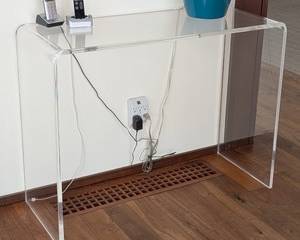 Lucite Console Table 

Modern Lucite console table with clean, minimalist lines. The table measures 38 inches wide by 15 inches deep and stands 29 inches high. Perfect for entryways, living rooms, or as an accent piece. Table only; contents pictured are not included.

Features:
Clear Lucite construction
Contemporary minimalist design
Dimensions: 38 in W x 15 in D x 29 in H