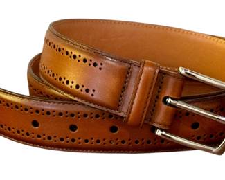 Classic Allen Edmonds men's leather belt in cognac brown, made in the USA. Features elegant brogued detailing and a polished silver-tone buckle. Belt size marked as 95/38.