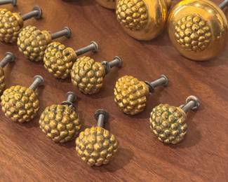 Set of 28 Vintage Gold-Tone Metal Drawer Pulls and Knobs

Collection of 27 matching vintage gold-tone metal drawer pulls and knobs featuring a textured, raised pattern. Includes 6 large round knobs and 21 smaller round knobs, each with attached screws for installation. The larger knobs measure approximately 1.75 inches in diameter, and smaller knobs are about 1 inch in diameter as shown. Great for refurbishing furniture or adding a decorative antique touch.

Features:

Set includes 6 large knobs and 21 small knobs
Gold-tone textured metal design
Mounting screws included