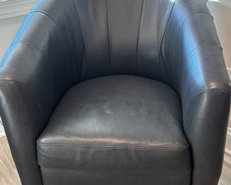 Navy Natuzzi leather swivel chair 