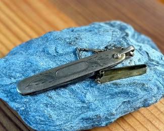 This lot features a vintage N.C. Co. two-blade pocket knife, potentially a fruit or gentleman’s knife, with a gold-filled engraved handle. 

