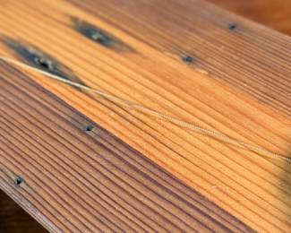 This lot features a vintage Ketcham & McDougall mechanical pencil disguised as a stick pin. It features a gold-filled body with a round, decorative top. 

