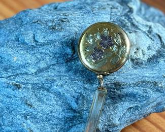 This lot features a vintage Ketcham & McDougall mechanical pencil disguised as a stick pin. It features a gold-filled body with a round, decorative top. 

