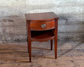 This lot features a Georgian-style mahogany nightstand with a single drawer that measures, 27” H x 18” W x 14” D.

