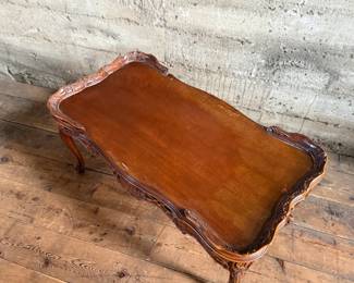 This lot features vintage French design carved mahogany coffee table that measures, 18” H x 38.5” W x 20.5” D.

