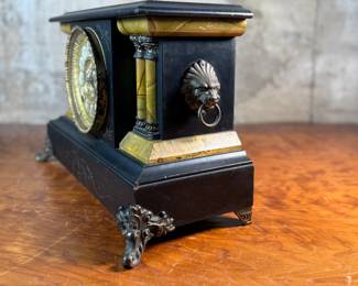 "Star", an antique mantel clock manufactured by W.M.L. Gilbert that measures, 10.75” H x 15.75” W x 7.25” D. Comes with key and pendulum in working condition.

