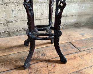 This lot features an antique Chinese carved rosewood marble-top plant stand that measures, 32” H x 13.5” W x 13.5” D. It features intricate carvings of leaf and floral motifs on the frieze, apron, and legs. These stands, also known as xiangji, are often considered antique or vintage pieces, with some dating back to the Republic Period (1912-1949).

