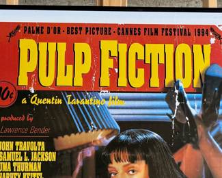 This lot features a Pulp Fiction movie poster that measures, 36” H x 24” W.

