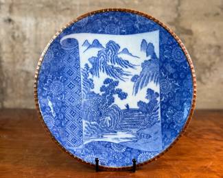 This lot features an antique Japanese Igezara blue and white porcelain charger plate that measures, 12.5” H x 12.5” W. This plate dates back to the Meiji period (circa 1880-1910). Igezara ware is known for being durable, thick porcelain produced mainly in the Arita region for the local market. 

